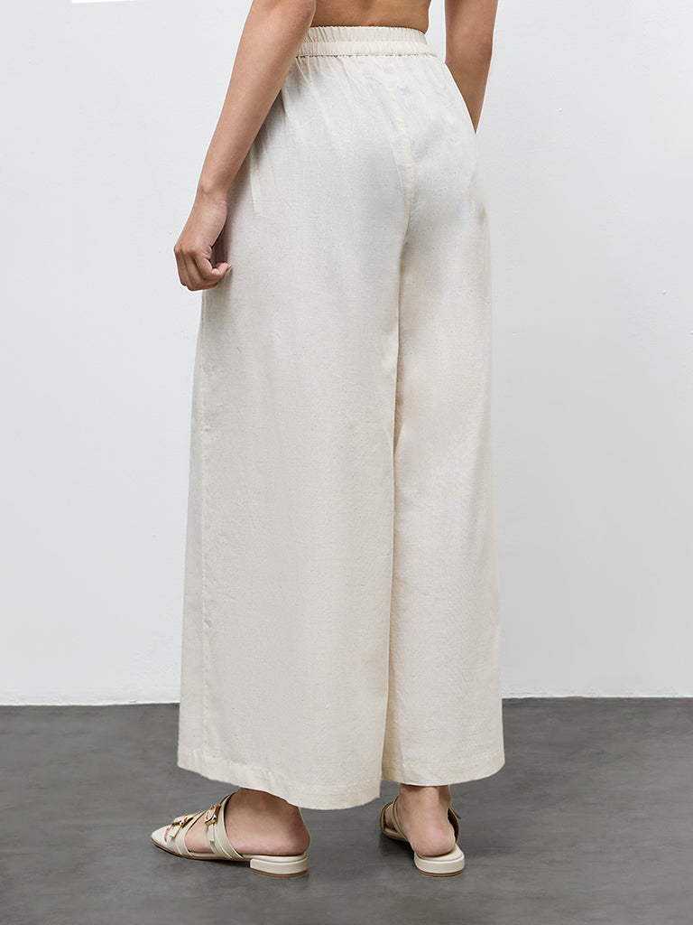 Utsa Off-White Solid Cotton-Blend Palazzos