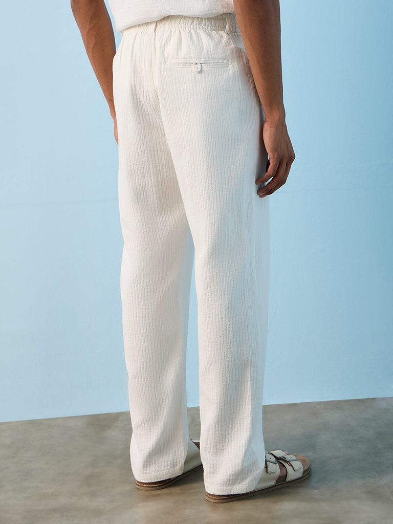 ETA Off-White Textured Relaxed-Fit Mid-Rise Cotton Pants