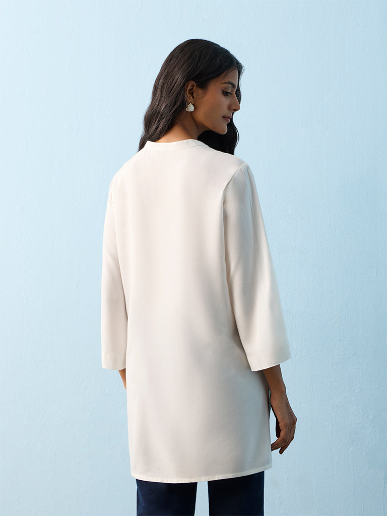 Utsa White Botanical Embroidered Straight Kurti