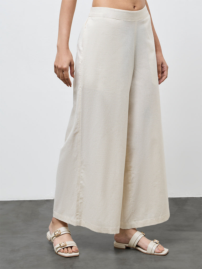 Utsa Off-White Solid Cotton-Blend Palazzos