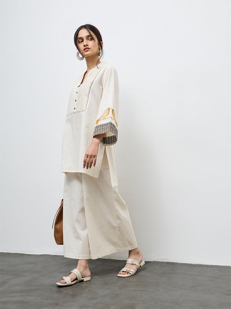 Utsa Off-White Solid Cotton-Blend Palazzos