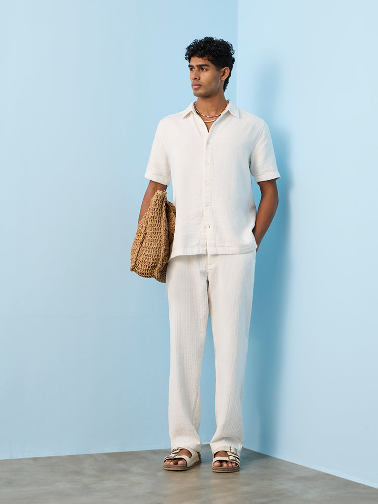 ETA Off-White Textured Relaxed-Fit Mid-Rise Cotton Pants