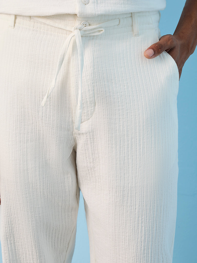 ETA Off-White Textured Relaxed-Fit Mid-Rise Cotton Pants